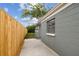 Private backyard with wooden fence and patio at 2305 N Tampania Ave, Tampa, FL 33607