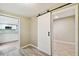 Hallway with barn door separating rooms and a view into the kitchen at 2305 N Tampania Ave, Tampa, FL 33607