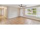 Living room with tiled floors and access to other rooms and backyard at 2305 N Tampania Ave, Tampa, FL 33607