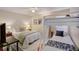 Bedroom featuring a queen bed and twin bunk beds at 103 Cypress Pond Rd # 103, Palm Harbor, FL 34683
