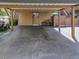 Carport area with covered parking spaces for residents at 103 Cypress Pond Rd # 103, Palm Harbor, FL 34683