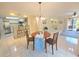 Bright dining area connects to the kitchen and living room, creating an open and inviting space at 103 Cypress Pond Rd # 103, Palm Harbor, FL 34683