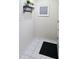 A well-lit foyer welcomes you with tile floors, wall decor, and coat storage at 103 Cypress Pond Rd # 103, Palm Harbor, FL 34683