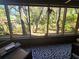 Enjoy the outdoors from the screened lanai with views of lush greenery and natural light at 103 Cypress Pond Rd # 103, Palm Harbor, FL 34683