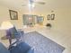Bright and open floor plan with living room and dining area, featuring tile flooring and modern decor at 103 Cypress Pond Rd # 103, Palm Harbor, FL 34683