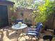 Charming patio featuring comfortable seating, potted plants, and a serene outdoor ambiance at 103 Cypress Pond Rd # 103, Palm Harbor, FL 34683