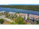 Aerial view of waterfront condos showcasing beautiful landscaping and convenient parking at 821 Bahia Del Sol Dr # 43, Ruskin, FL 33570