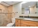 Well-lit bathroom featuring tiled shower, vanity with granite countertop, and modern fixtures at 821 Bahia Del Sol Dr # 43, Ruskin, FL 33570