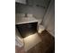 Modern bathroom featuring dark vanity, white sink, and tiled floor at 821 Bahia Del Sol Dr # 43, Ruskin, FL 33570