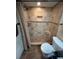 Shower with a built in seat, mosaic tile accents, and neutral color palette at 821 Bahia Del Sol Dr # 43, Ruskin, FL 33570