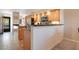 Open floor plan showing kitchen with stainless appliances and a breakfast bar that leads to the living area at 821 Bahia Del Sol Dr # 43, Ruskin, FL 33570