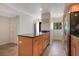 Modern kitchen island with granite countertop, storage cabinets, and tile flooring at 821 Bahia Del Sol Dr # 43, Ruskin, FL 33570