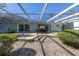 Spacious patio with covered seating area, brick flooring, and lush landscaping at 236 45Th Ave, St Pete Beach, FL 33706