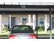 Covered parking spot for one car, located near building entrance at 8693 Bardmoor Blvd # 207B, Seminole, FL 33777