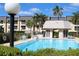 Inviting community pool area with gazebo and seating at 8693 Bardmoor Blvd # 207B, Seminole, FL 33777