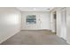 Living area with an exterior door and closet at 101 Lake Ne Ave # 225, Largo, FL 33771