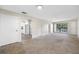 Living room with doors to patio and kitchen access at 101 Lake Ne Ave # 225, Largo, FL 33771