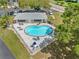 Community pool with lounge chairs and patio area at 101 Lake Ne Ave # 225, Largo, FL 33771