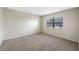 Carpeted bedroom with window and ample natural light at 101 Lake Ne Ave # 225, Largo, FL 33771