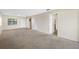 Living room with access to exterior door and hallway at 101 Lake Ne Ave # 225, Largo, FL 33771