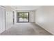 Bright living room with sliding glass doors leading to a balcony at 101 Lake Ne Ave # 225, Largo, FL 33771