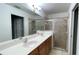 Primary bathroom with double sinks and a large shower at 1823 Twilight Tides St, Tarpon Springs, FL 34689