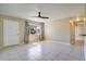 Bright living room with tile floors and a ceiling fan at 5288 62Nd N St, Kenneth City, FL 33709