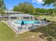 Inviting kidney-shaped community pool with ample lounge chairs at 101 Lake Ne Ave # 125, Largo, FL 33771