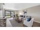 Living room with sofa and chairs near sliding doors at 101 Lake Ne Ave # 125, Largo, FL 33771