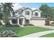 Two-story Craftsman home with a charming front porch at 1298 Almaria Ct, Palm Harbor, FL 34683