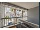 Balcony with view of palm trees and community at 235 Nautilus Way, Treasure Island, FL 33706