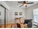 Spacious home office features wood desk, ceiling fan and mirrored closet at 235 Nautilus Way, Treasure Island, FL 33706