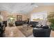 Spacious living room with leather sofas and a view of the kitchen at 3610 11Th N Ave, St Petersburg, FL 33713