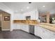 Elegant kitchen with white cabinets, granite counters, and stainless steel appliances at 3610 11Th N Ave, St Petersburg, FL 33713