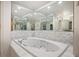 Bathroom with jetted tub and large mirrors at 3610 11Th N Ave, St Petersburg, FL 33713