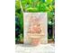 Ornate terracotta fountain featuring cherubs in a lush garden setting at 3610 11Th N Ave, St Petersburg, FL 33713