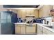 Well-equipped kitchen with wood cabinets, modern appliances, and ample counter space at 2205 Belleair Rd # A13, Clearwater, FL 33764