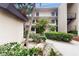 Exterior of building with landscaping and walkway at 2205 Belleair Rd # A13, Clearwater, FL 33764