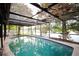 Screened-in pool with lake view at 1901 Ohio Ne Ave, St Petersburg, FL 33703