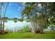 Peaceful lakefront view with lush landscaping at 1901 Ohio Ne Ave, St Petersburg, FL 33703