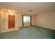 Simple living room with large window and wood door at 1901 Ohio Ne Ave, St Petersburg, FL 33703