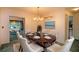 Elegant dining room with a chandelier and oval table at 1901 Ohio Ne Ave, St Petersburg, FL 33703