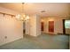 Dining room with a chandelier and access to kitchen at 1901 Ohio Ne Ave, St Petersburg, FL 33703
