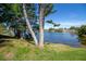 Picturesque lake view with mature trees at 1901 Ohio Ne Ave, St Petersburg, FL 33703