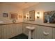 Small basement bathroom with pedestal sink, toilet and framed pictures at 1901 Ohio Ne Ave, St Petersburg, FL 33703