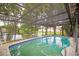 Relaxing screened pool area overlooking a lake at 1901 Ohio Ne Ave, St Petersburg, FL 33703