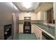 Kitchen features stainless steel appliances and green tile countertops at 1901 Ohio Ne Ave, St Petersburg, FL 33703