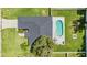 Aerial view showing house, pool, and backyard at 1729 Oakwood Estates Dr, Plant City, FL 33563