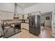 Modern kitchen features stainless steel appliances and granite countertops at 1729 Oakwood Estates Dr, Plant City, FL 33563