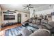 Spacious living room with sectional sofa and wood floors at 1729 Oakwood Estates Dr, Plant City, FL 33563